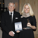 18 November: The Crown Princess is presented with the Tora Mostrastong Award by initiater Mr Håkon Randal and Chairman of the Board, Ms Birthe Taraldset (Photo: Eva Groven, Budstikka)